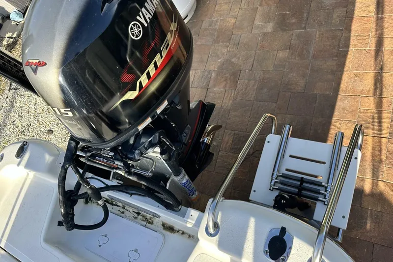 Slide: The Image of 2020 NauticStar 2140 Sport Shallow Bay with Yamaha VMAX 115 outboard engine. - 30