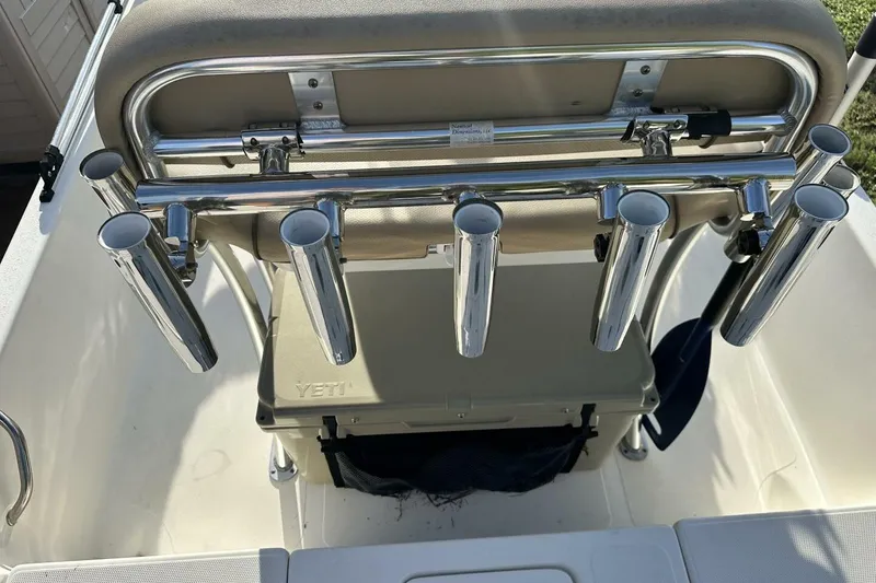 Slide: The Image of 2020 NauticStar 2140 Sport Shallow Bay boat with rod holders and Yeti cooler. - 35