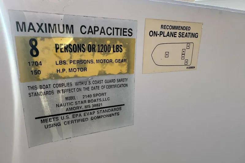Slide: The Image of 2020 NauticStar 2140 Sport Shallow Bay capacity label, seating diagram, safety compliance. - 45
