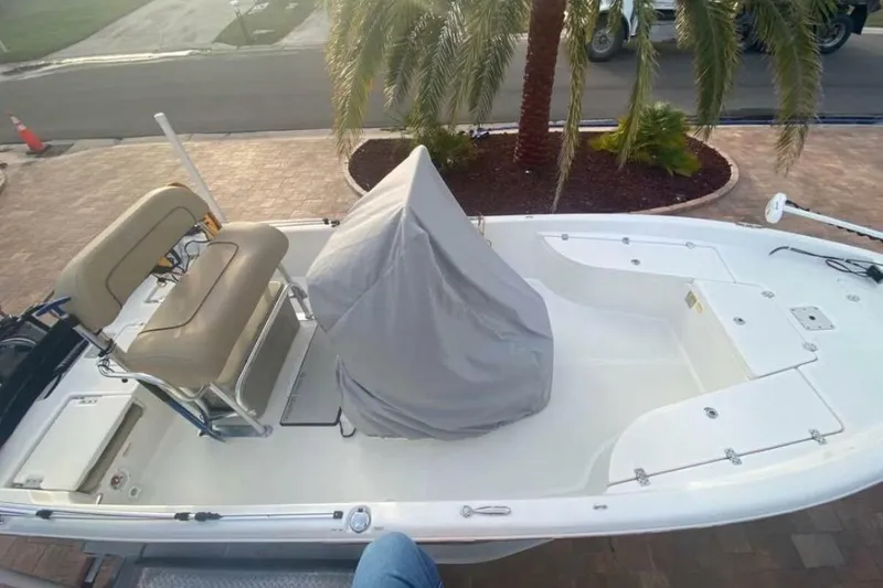 Slide: The Image of 2020 NauticStar 2140 Sport Shallow Bay boat with covered console and seating. - 54
