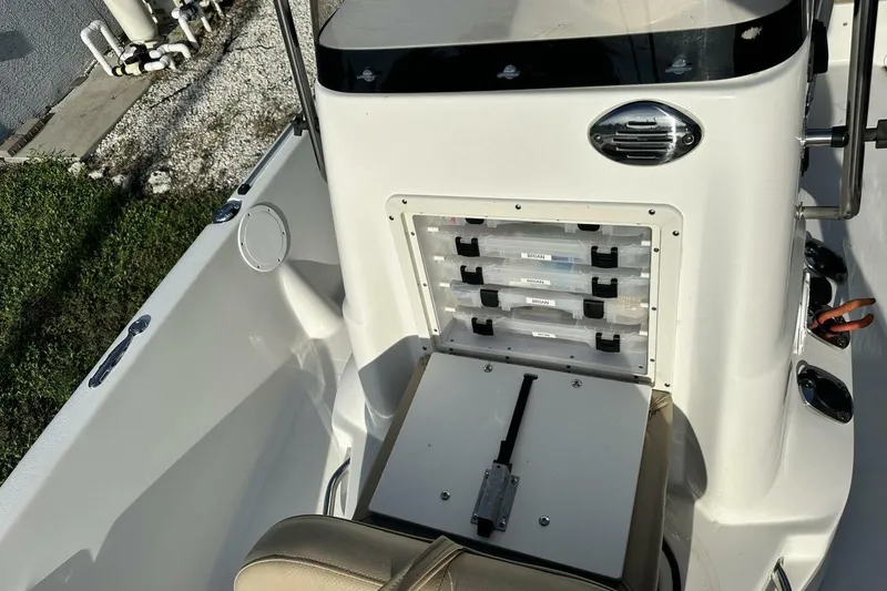 Slide: The Image of 2020 NauticStar 2140 Sport Shallow Bay boat interior with storage compartments. - 9