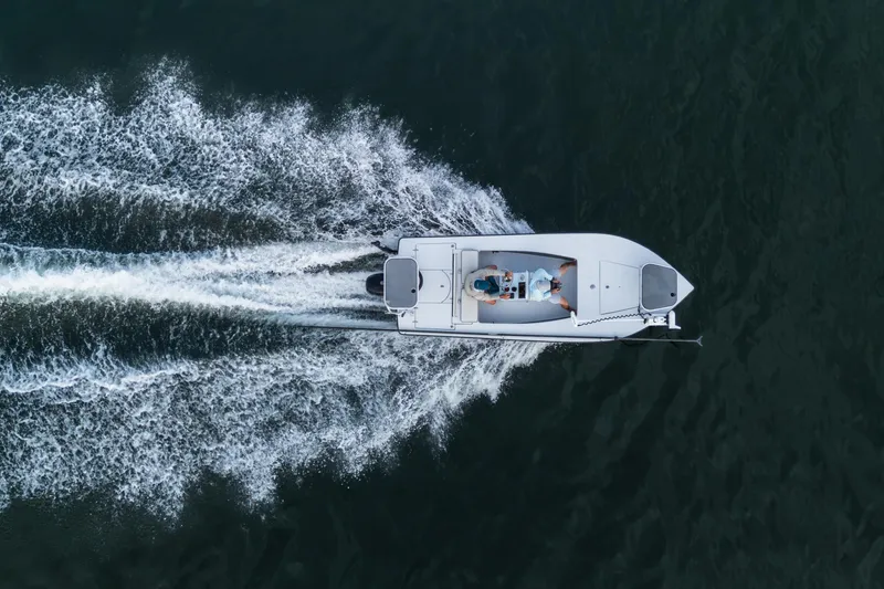 Slide: The Image of Aerial view of 2020 East Cape 18 EVO boat speeding on water. - 29