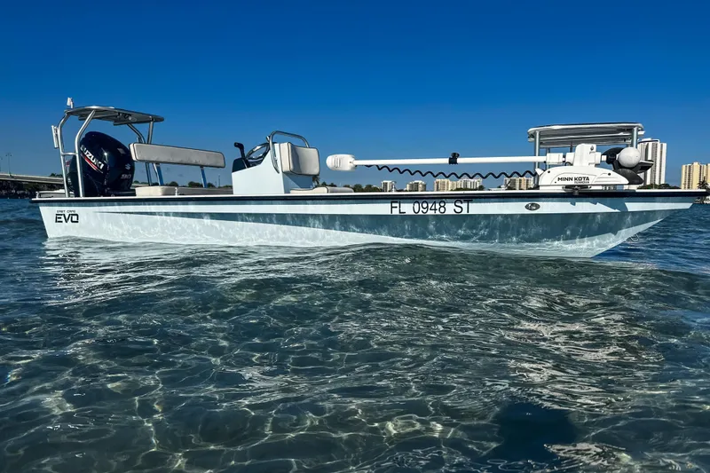 The Image of 2020 East Cape Evo V boat on clear water with city skyline background. - 1