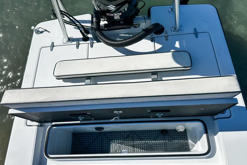 Slide: The Image of 2020 East Cape Evo V boat with open storage compartment and seating. - 13