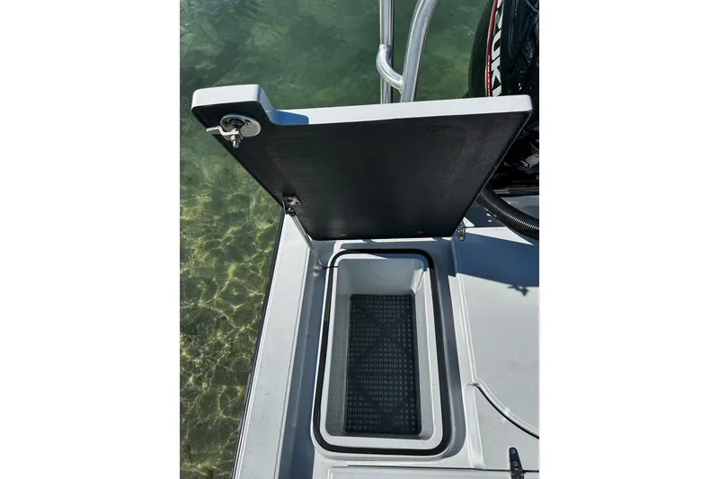 Slide: The Image of Open storage compartment on 2020 East Cape Evo V boat, showing interior details. - 15