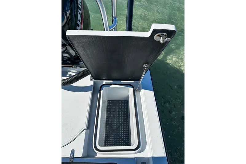 Slide: The Image of Open storage compartment on 2020 East Cape Evo V boat, showing interior details. - 16