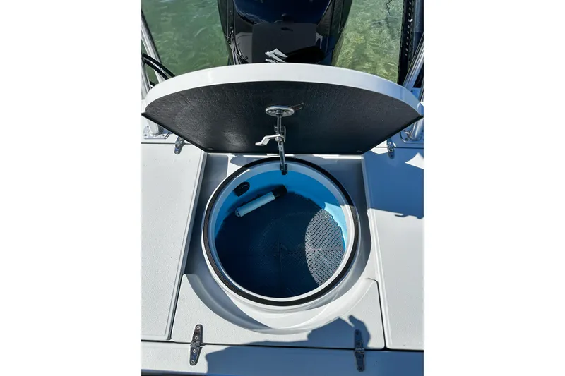Slide: The Image of Open livewell on 2020 East Cape Evo V boat, showcasing interior design and functionality. - 17