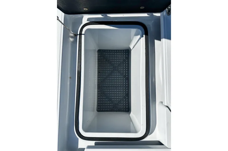 Slide: The Image of 2020 East Cape Evo V boat storage compartment with black mat inside. - 20