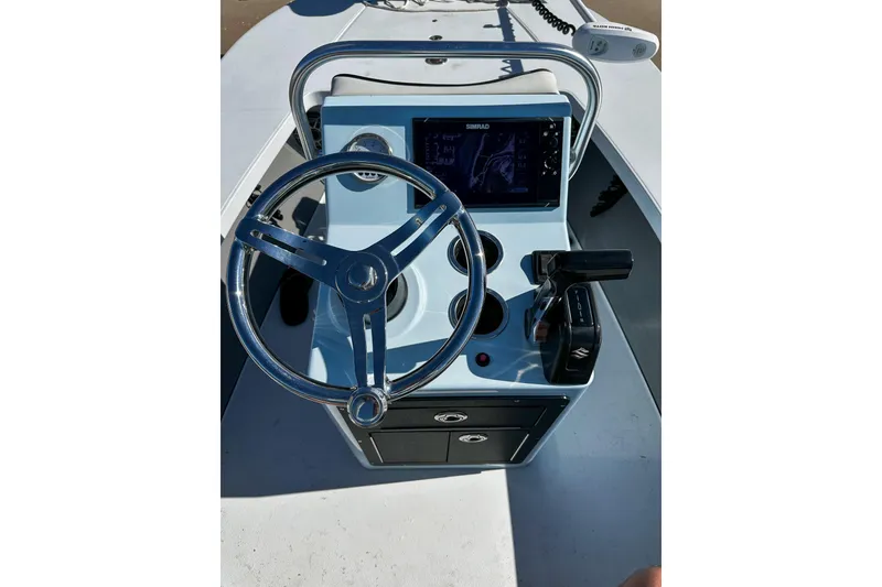 Slide: The Image of 2020 East Cape Evo V boat console with steering wheel and navigation display. - 3