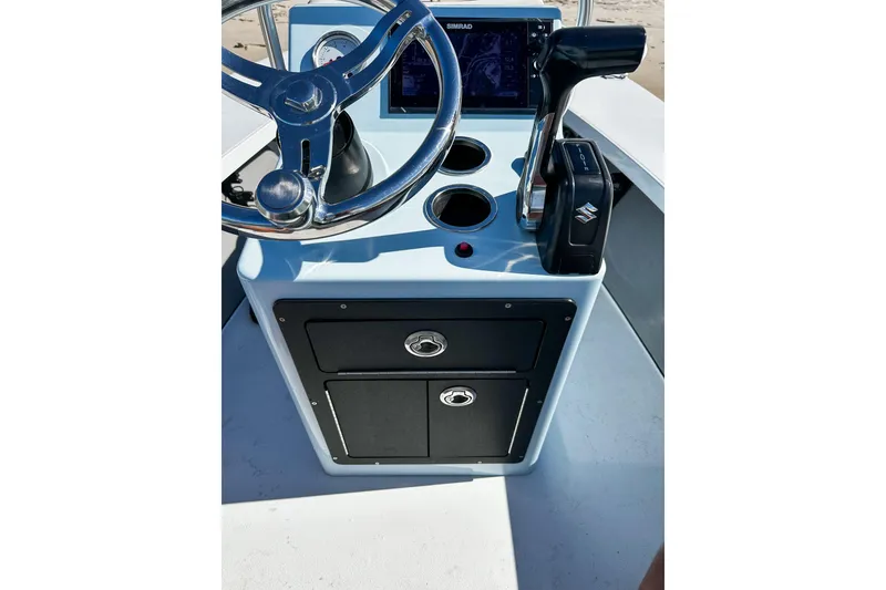 Slide: The Image of 2020 East Cape Evo V boat console with steering wheel and controls. - 4