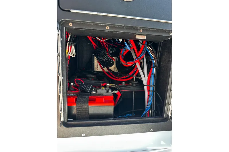 Slide: The Image of 2020 East Cape Evo V electrical compartment with red and blue wiring. - 5