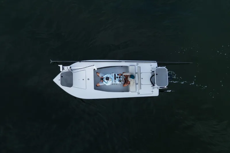 Slide: The Image of Aerial view of 2020 East Cape 18 EVO boat on dark water. - 36