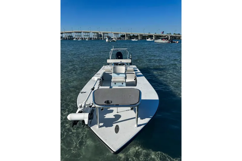 Slide: The Image of 2020 East Cape Evo V boat on clear water near a bridge. - 9