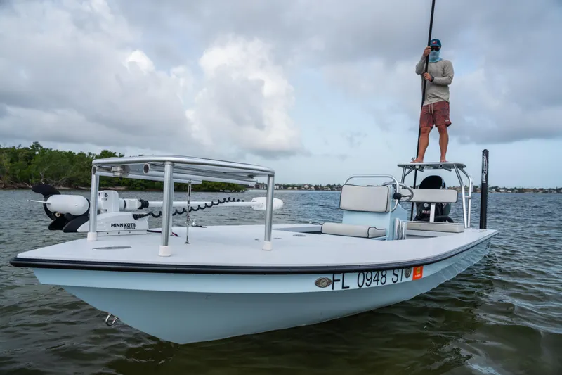 Slide: The Image of 2020 East Cape 18 EVO boat with Minn Kota trolling motor on calm water. - 35