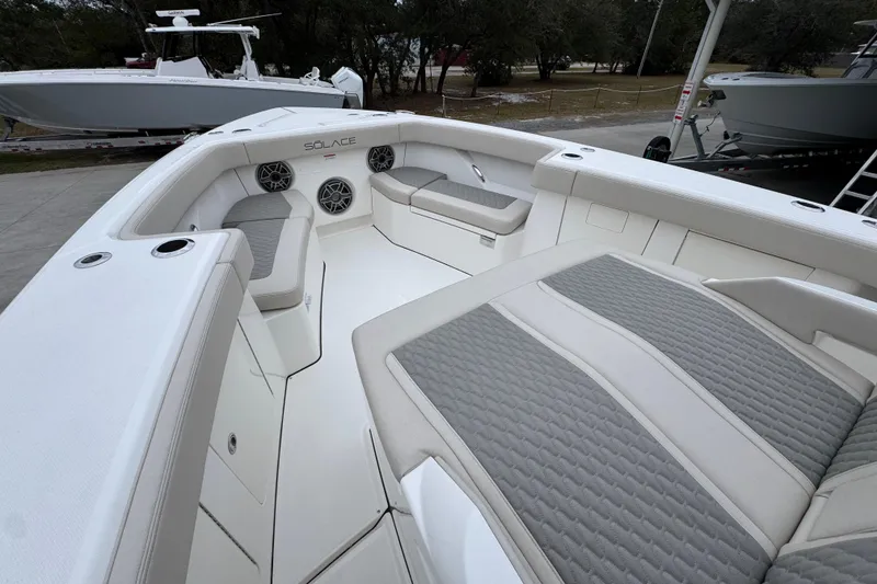 Slide: The Image of Luxurious 2026 Solace 35 CS boat interior with cushioned seating and modern design. - 21
