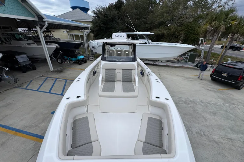 Slide: The Image of 2026 Solace 35 CS boat with spacious seating, docked at a marina. - 23