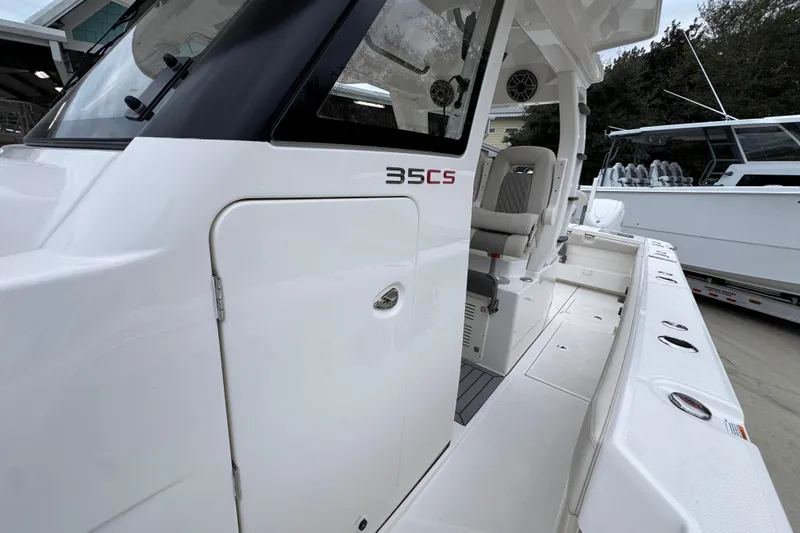 Slide: The Image of 2026 Solace 35 CS boat, sleek white exterior, spacious deck, modern design. - 25
