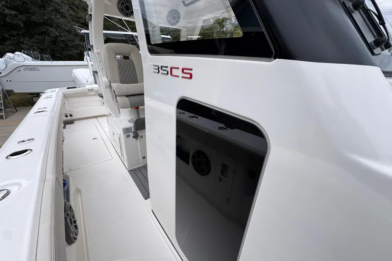 Slide: The Image of 2026 Solace 35 CS boat interior with seating and sleek design. - 26