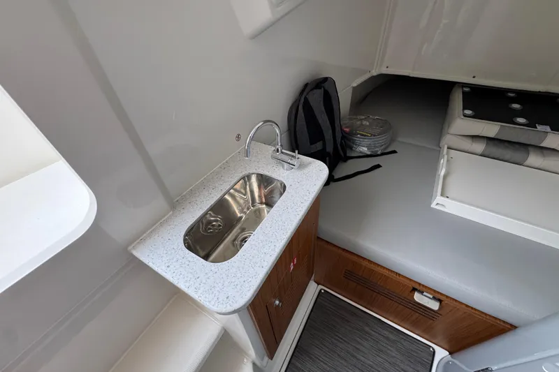 Slide: The Image of Interior of 2026 Solace 35 CS boat with sink, seating, and storage. - 29