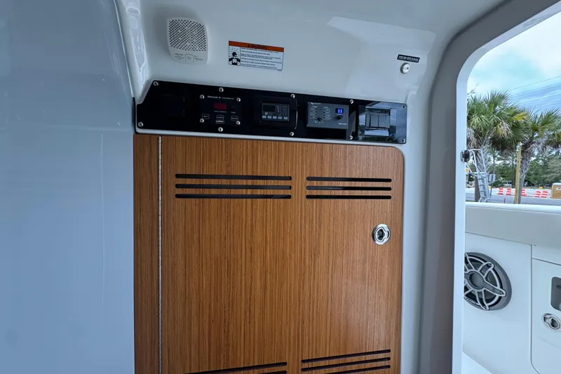 Slide: The Image of Interior view of 2026 Solace 35 CS boat with control panel and wooden cabinet. - 30