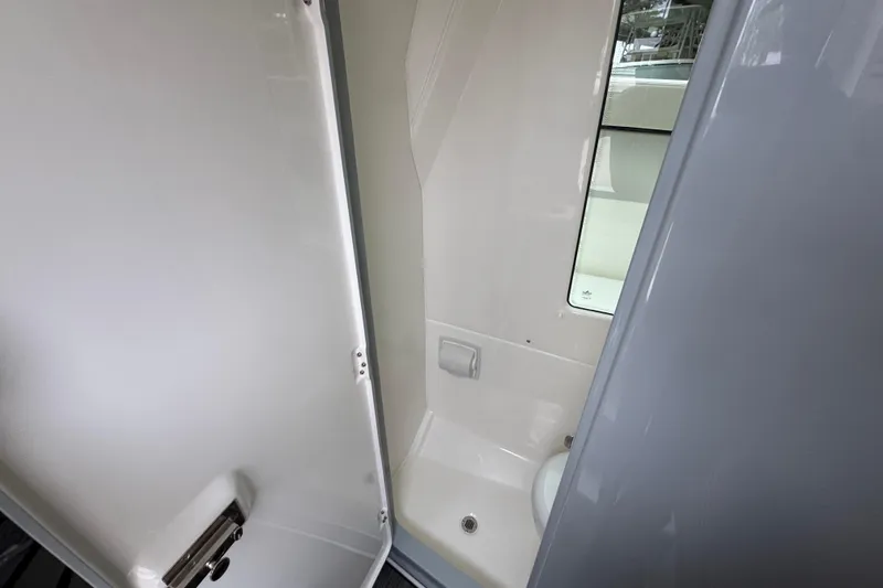 Slide: The Image of Bathroom interior of 2026 Solace 35 CS boat, featuring sleek design and compact layout. - 32