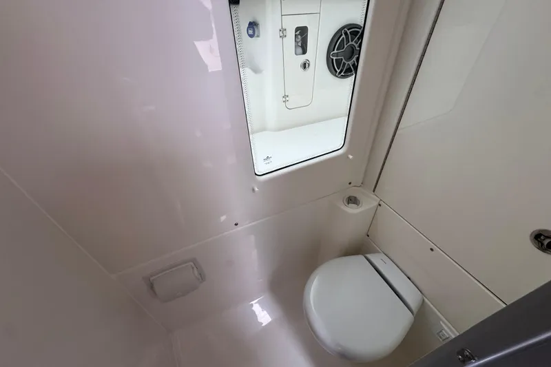 Slide: The Image of 2026 Solace 35 CS boat interior bathroom with modern toilet and sleek design. - 33