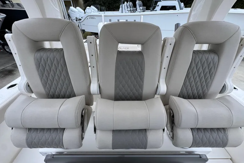 Slide: The Image of Luxury seating on 2026 Solace 35 CS boat, featuring elegant gray upholstery. - 35