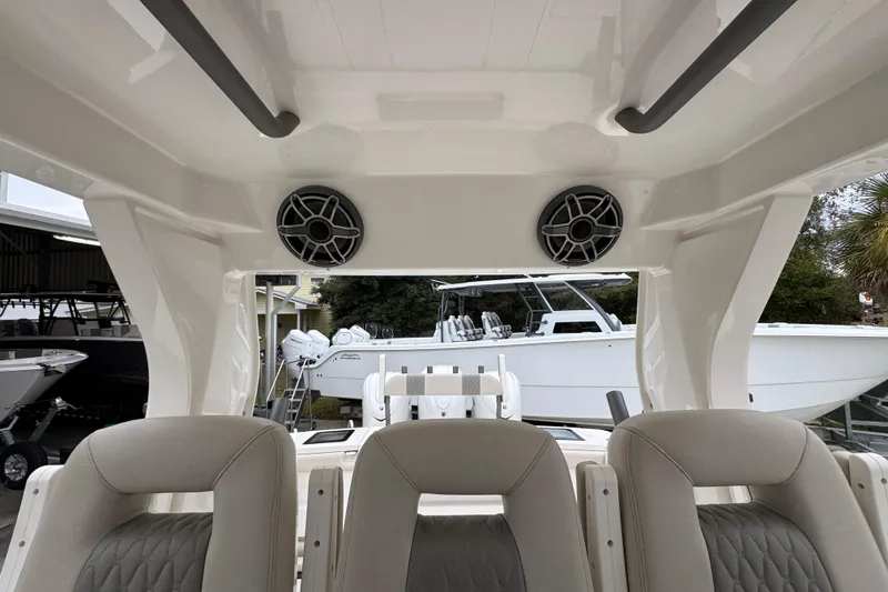 Slide: The Image of Interior view of 2026 Solace 35 CS boat with speakers and seating. - 36