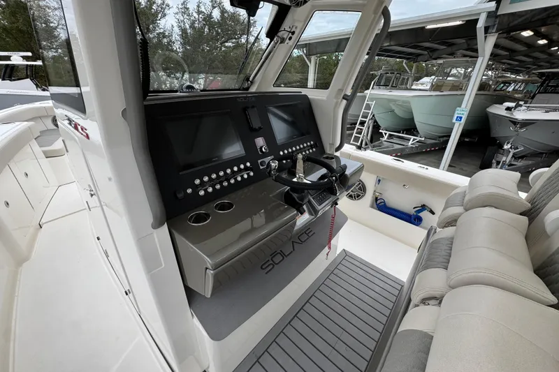 Slide: The Image of 2026 Solace 35 CS boat cockpit with modern controls and comfortable seating. - 38