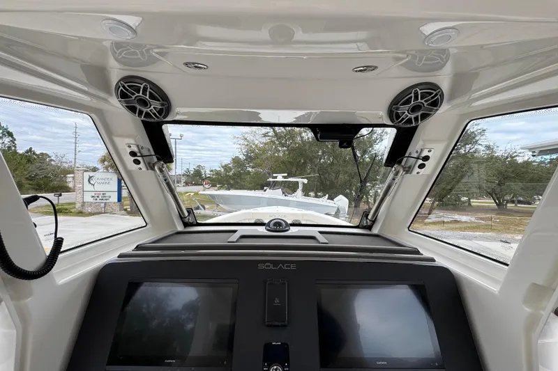 Slide: The Image of Interior view of 2026 Solace 35 CS boat cockpit with modern navigation displays. - 40