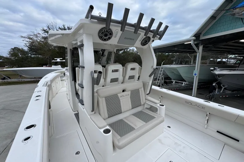 Slide: The Image of 2026 Solace 35 CS boat with modern seating and fishing rod holders. - 44