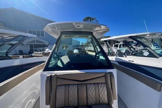 Slide: The Image of 2026 Monterey Elite 27 OB boat interior with speaker and storage compartment. - 12