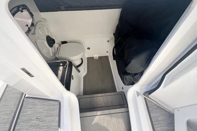 Slide: The Image of 2026 Monterey Elite 27 OB boat interior with Yeti cooler and seating. - 14