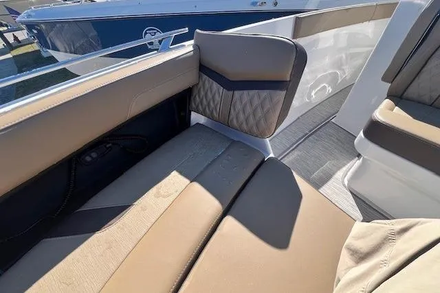 Slide: The Image of 2026 Monterey Elite 27 OB boat dashboard with modern steering and digital display. - 16