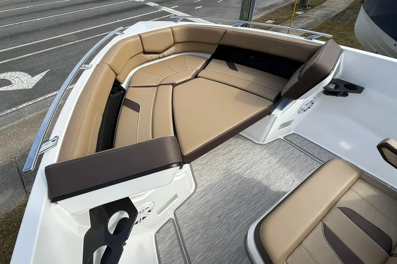 Slide: The Image of 2026 Monterey Elite 27 OB boat interior with tan seating and modern design. - 20