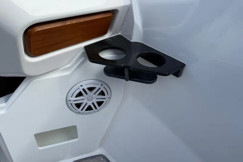 Slide: The Image of Cup holder and speaker on 2026 Monterey Elite 27 OB boat interior. - 21