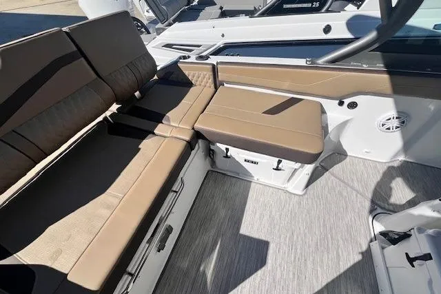Slide: The Image of Luxurious seating on 2026 Monterey Elite 27 OB boat with tan upholstery and modern design. - 6