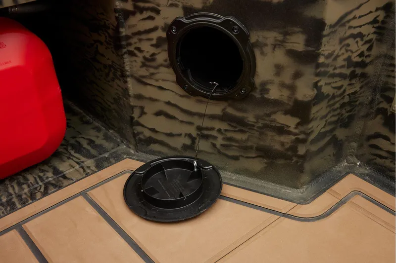 Slide: The Image of Manufacturer Provided Image: Fuel cap and compartment of 2026 Tracker Grizzly 1650 T Prairie Wings Edition boat. - 19