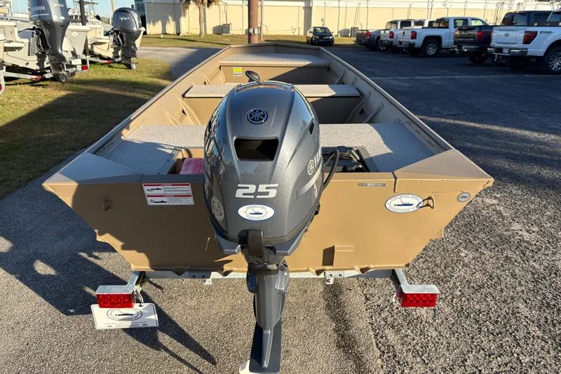 Slide: The Image of 2026 SeaArk 1648 MV boat with Yamaha 25 outboard motor, parked outdoors. - 4