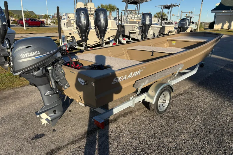 Slide: The Image of 2026 SeaArk 1648 MV boat with Yamaha motor on trailer, parked outdoors. - 5