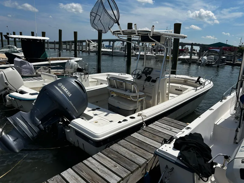 The Image of 2015 Carolina Skiff 21 Ultra Elite boat docked with Yamaha outboard motor. - 0