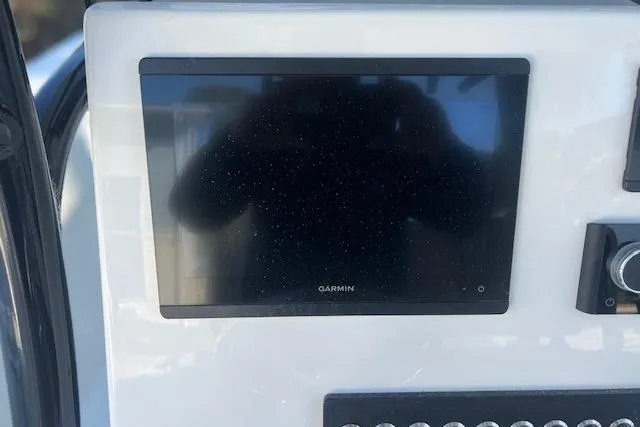 Slide: The Image of Key West 263 FS 2026 boat console with Yamaha and Fusion controls. - 11