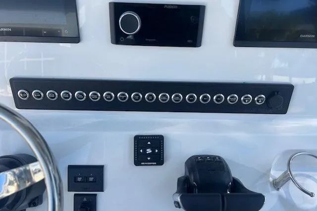 Slide: The Image of Steering wheel of Key West 263 FS boat, year 2026. - 14