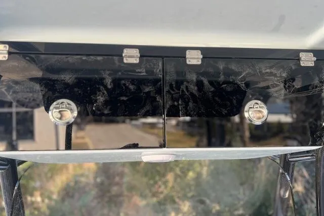 Slide: The Image of Interior view of a Key West 263 FS boat surrounded by trees. - 16