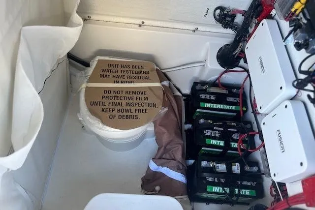 Slide: The Image of Interior of Key West 263 FS boat, 2026 model, featuring white upholstery. - 18