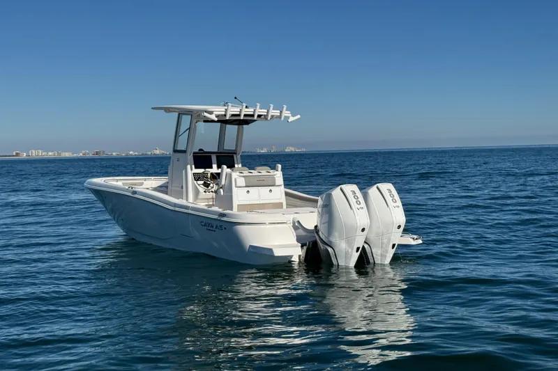 Slide: The Image of 2026 Caymas 291 boat with dual engines on open water. - 3