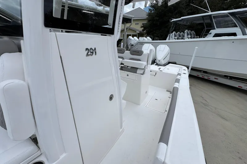 Slide: The Image of 2026 Caymas 291 boat interior with seating and dual engines. - 31