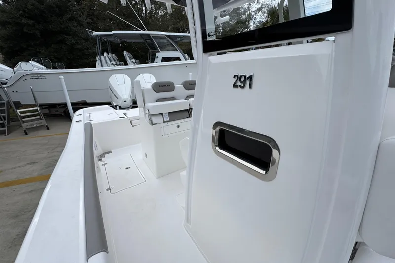 Slide: The Image of 2026 Caymas 291 boat interior with seating and console details. - 32
