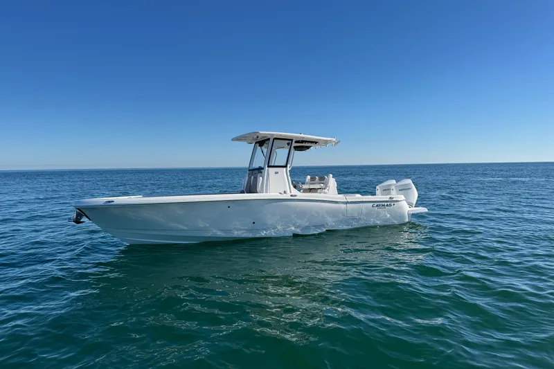 Slide: The Image of 2026 Caymas 291 boat on open water under clear blue sky. - 8