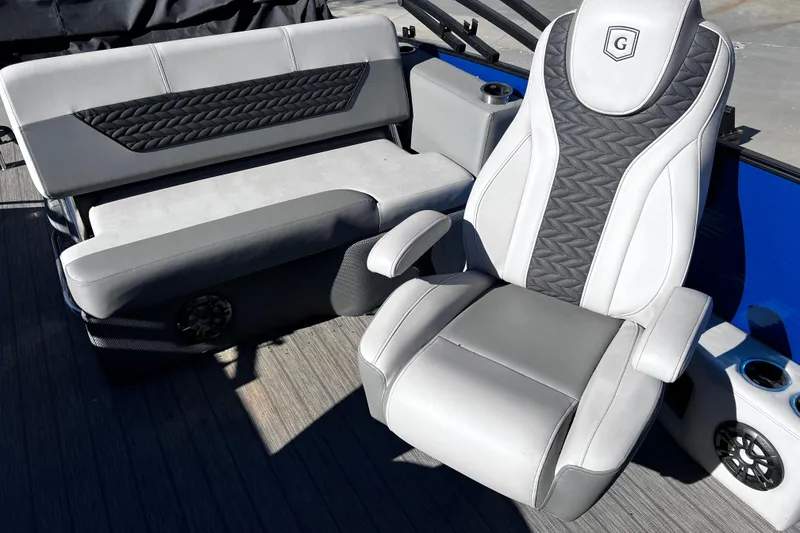Slide: The Image of Luxury seating on 2022 Godfrey Monaco 235 SFL pontoon boat, featuring stylish upholstery and design. - 11